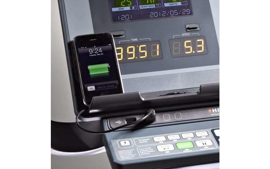 Smartphone sitting on LifeSpan C7000i Commercial's console