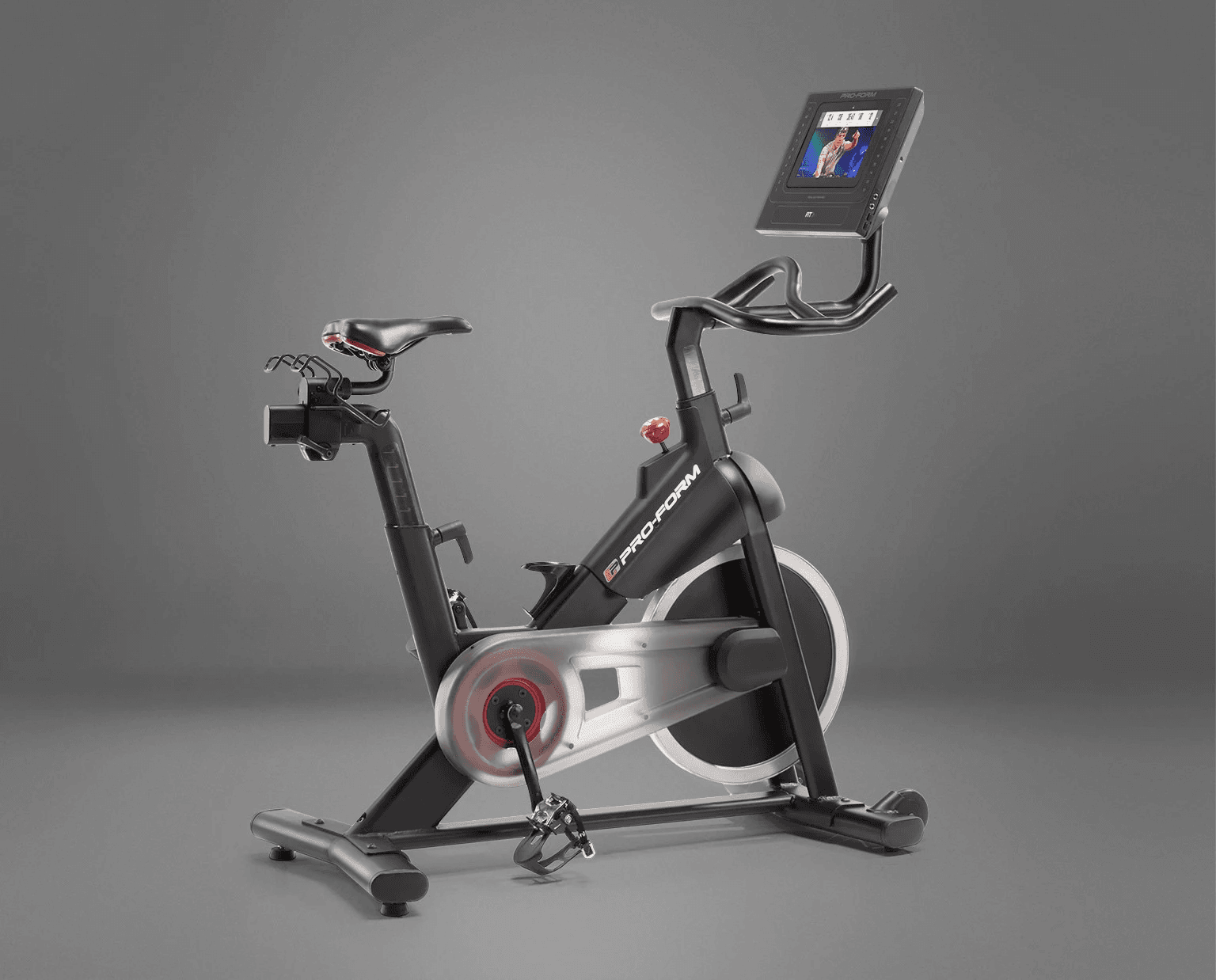 A black, grey, and red exercise bike with display console.