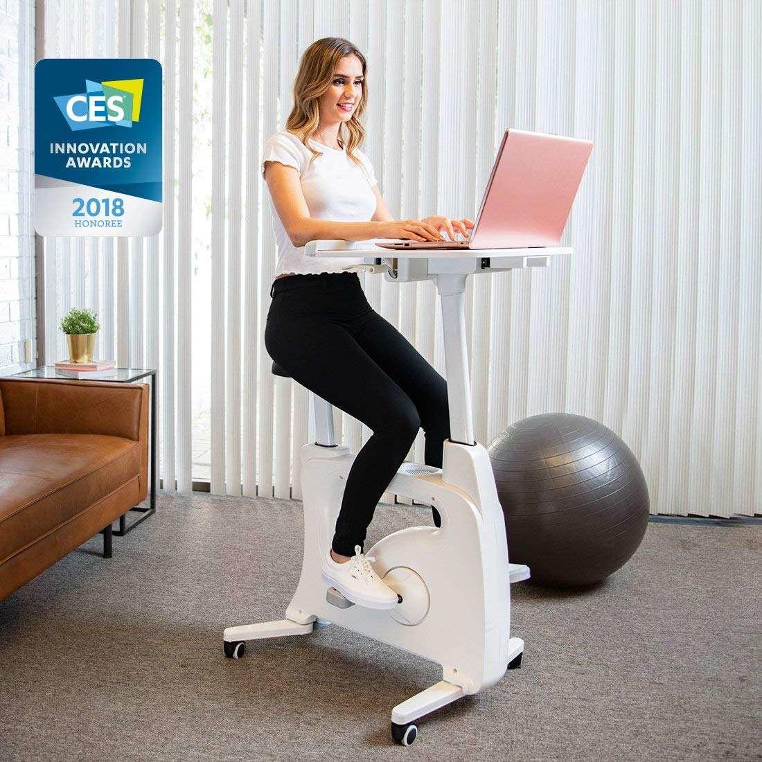 woman using Deskcise Pro as a work desk