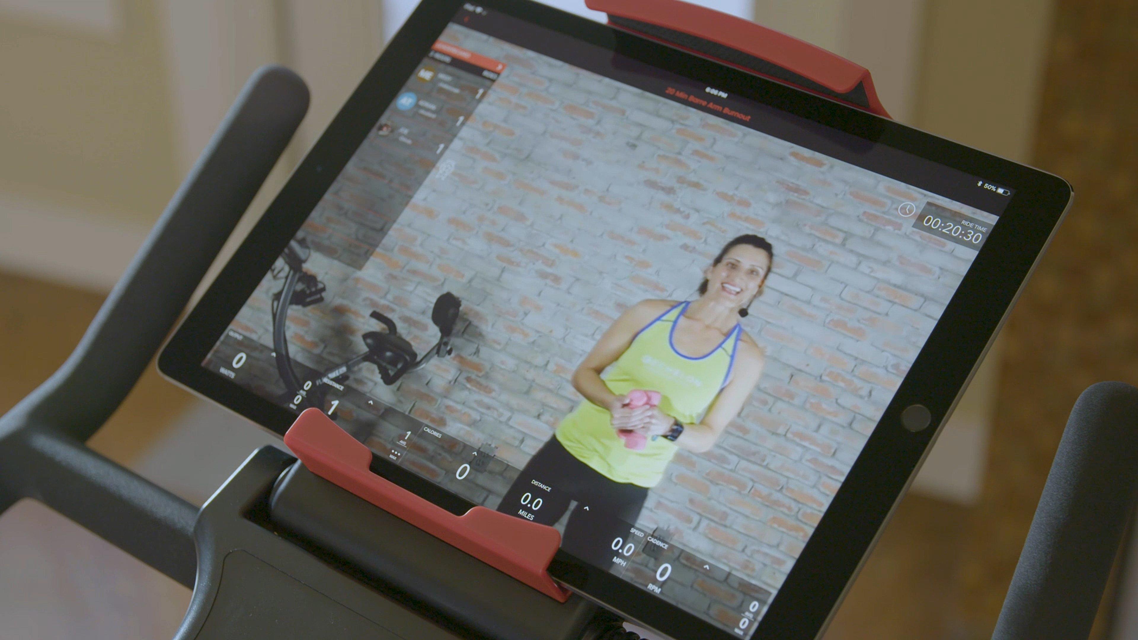 young woman trainer on an ipad screen for the echelon ex3s model
