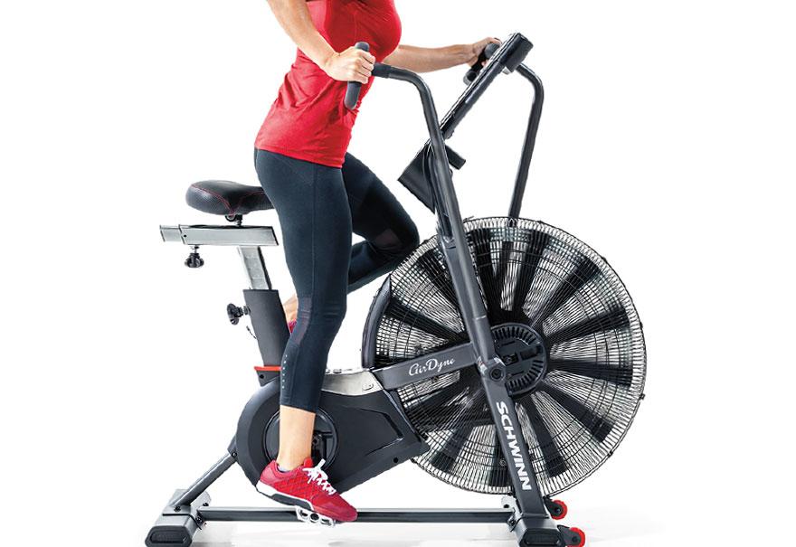 Side view of a woman on Schwinn Airdyne AD Pro